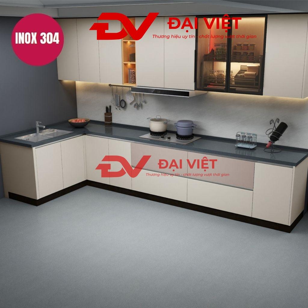 Modern stainless steel kitchen cabinets with polished granite countertop in a Vietnamese home kitchen setting