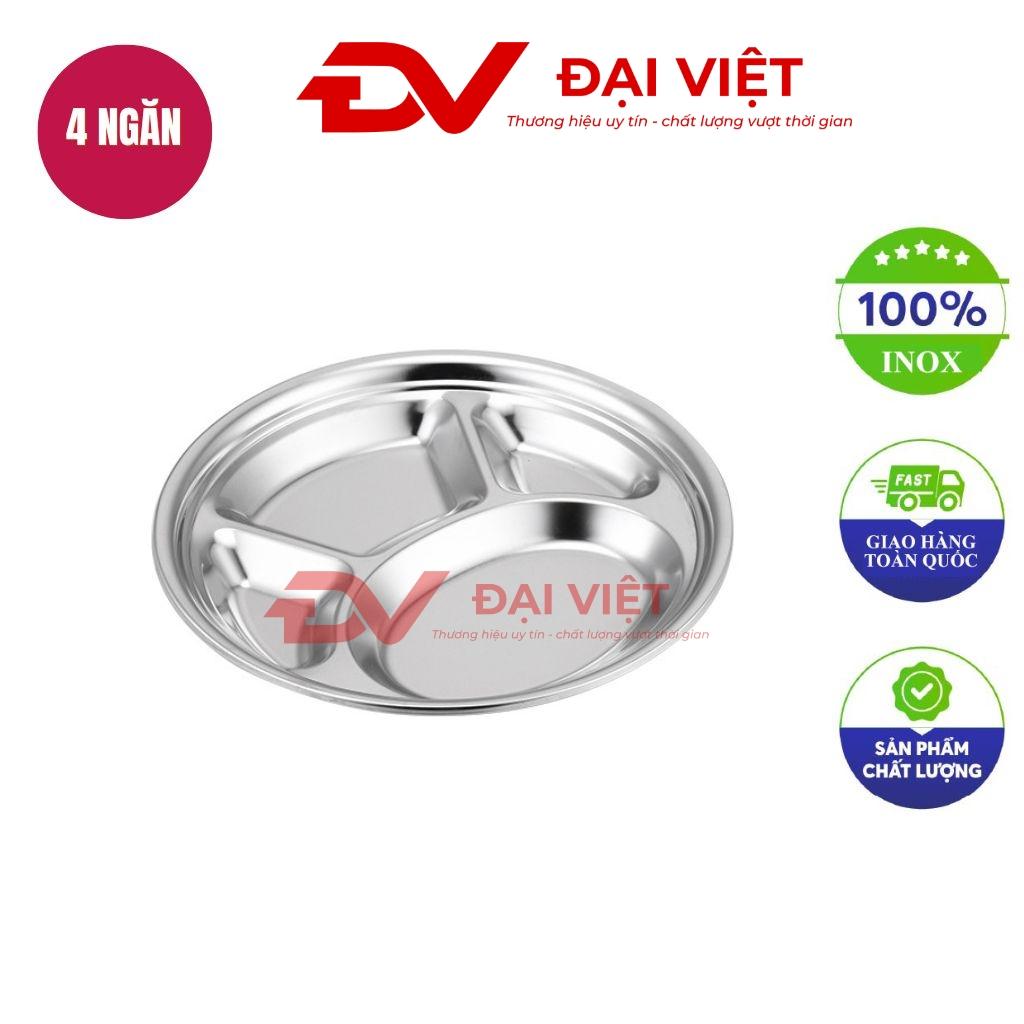 A stainless steel round tray with four compartments polished surface safe rounded edges kitchen background