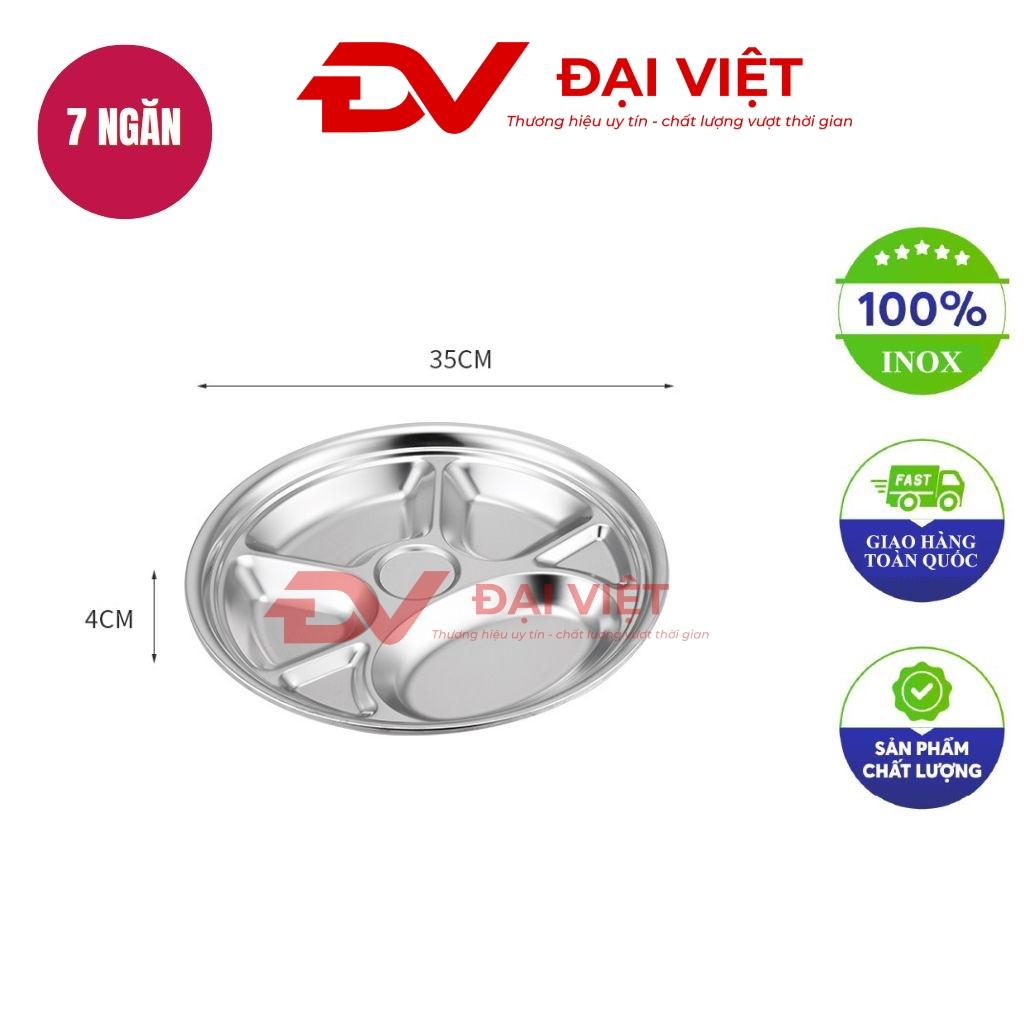 Image of round stainless steel tray with 7 compartments shiny and clean modern kitchen background