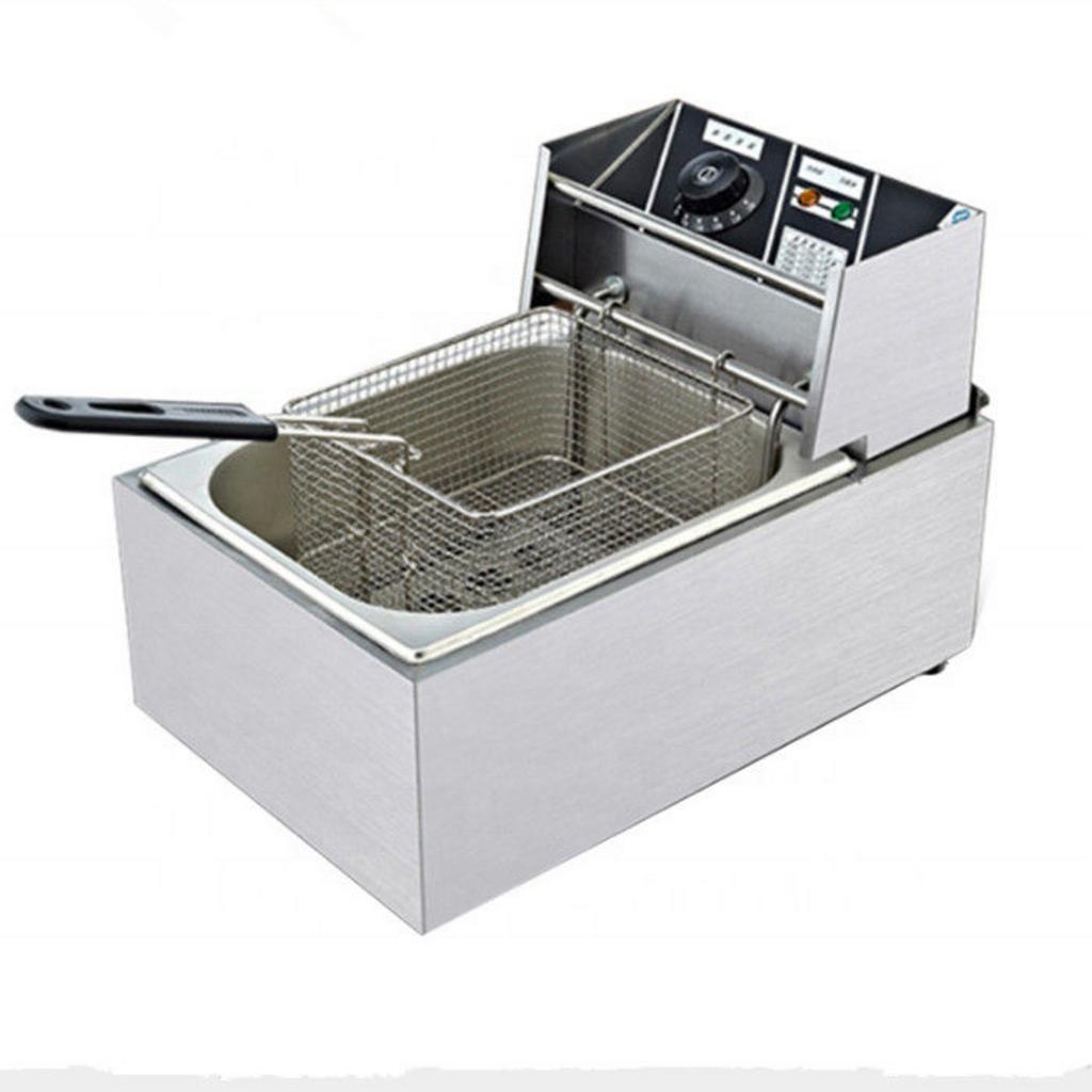 Van xả dầu và khay hứng mỡ trên bếp chiên.